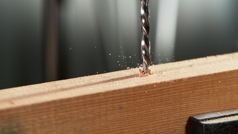 Super slow motion of detail of a drill bit drilling into wood. Filmed on high speed cinema camera, 1000 fps.

