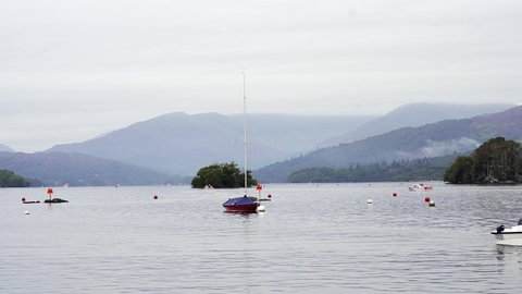 Zoomed in view of Lake Windermere in the Lake District with the distant fells shrouded in low cloud. Cumbria, England, UK