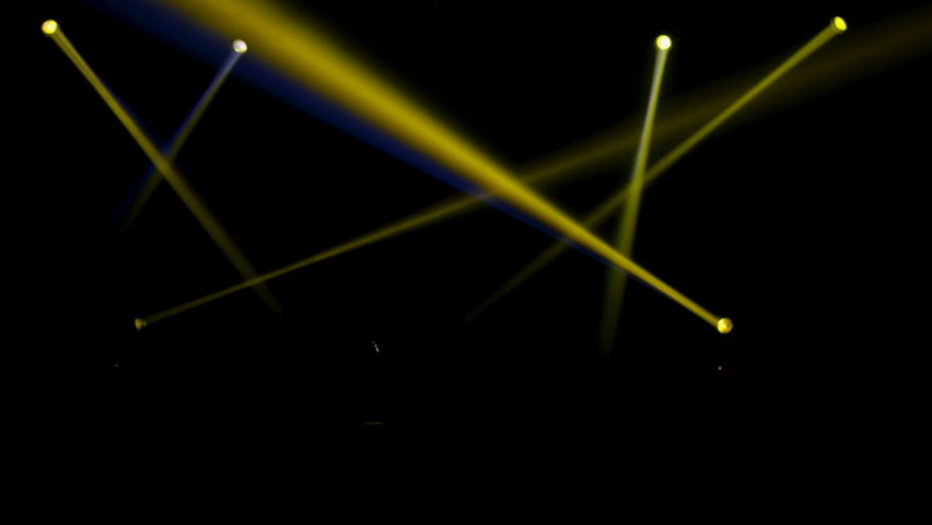Pub or nightclub disco lights with different colors on stage during party or show of music band. Light Lasers shooting. colorful green color laser beams dance at nightclub.