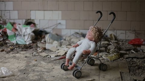 baby carriage with a doll in an abandoned house.
