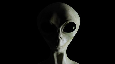 Spooky alien's face on black background. UFO and extraterrestrial life concept.