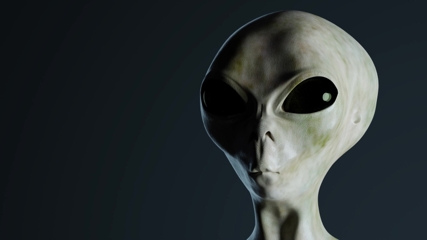Spooky alien's face on black background. UFO and extraterrestrial life concept. Royalty-Free Stock Footage #1063602874