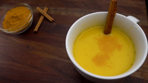 Turmeric Powder Added to Golden Milk Latte Medicinal Beverage
