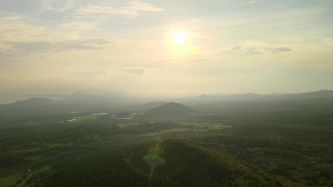 4K Drone View of Sunset over Hills on a Slope of Hallasan, Jeju Island.
Hallasan is the main volcanic mountain in Jeju Volcanic Island, a UNESCO World Heritage site.