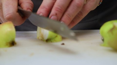 Woman Slicing Green Apples On Chopping Board - Close Up, Slow Motion Shot