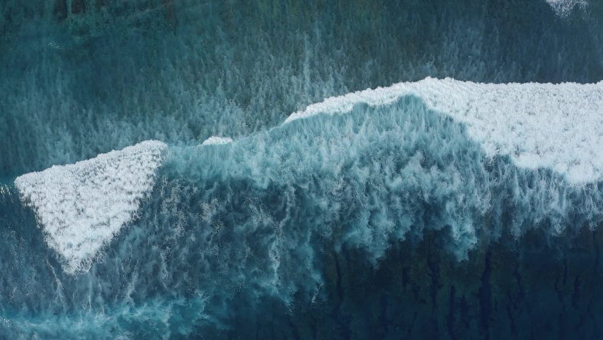 Slow motion top view of sea foamy bewitchingly splashing waves on a gloomy summer day. Concept of the beauty of nature and the power of the elements Royalty-Free Stock Footage #1063618024