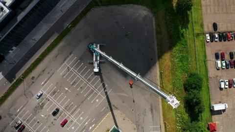 The biggest mobile truck crane. Epic cinematic extreme drone flight along extended boom of a large mobile truck crane