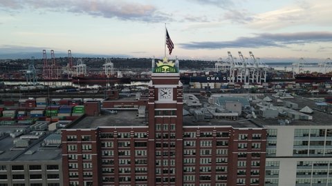 Seattle , WA , United States - 11 27 2020: Zoom out, reveal the original corporate headquarters of Starbucks Coffee clock tower