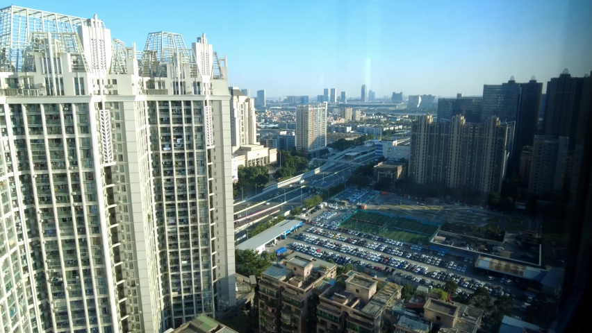 Time lapse of highway in a distance in city downtown district. Guangzhou, Guangdong, China, Asia.