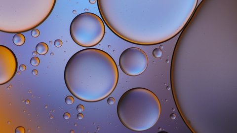 Pastel color of oil drop floating on the water. Pastel color bubble for background.