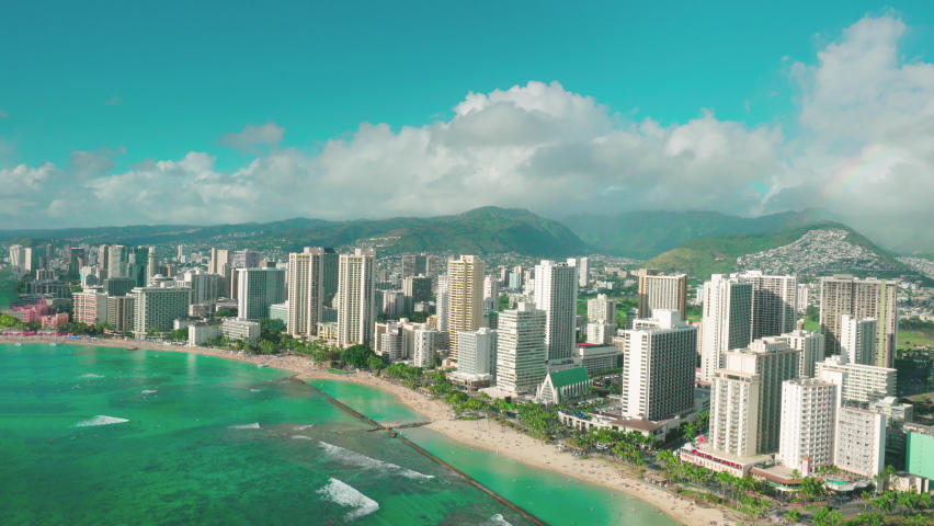 Honolulu cityscape, aerial view of Waikiki skyline, Ala Wai canal and Kapi olani Regional Park. Oahu is the third largest Hawaiian island. Hawaii, United States. Royalty-Free Stock Footage #1063650538