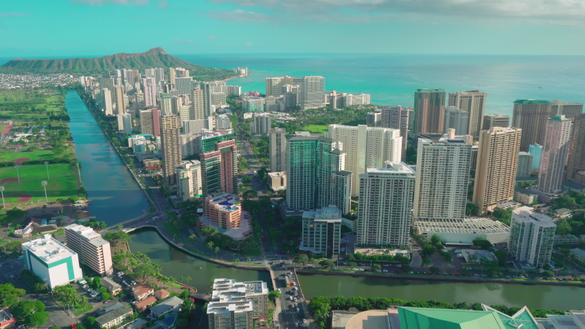 Aerial view of Ala Wai Canal in Honolulu. It is an artificial waterway running from Kapahulu Avenue along the length of Waikīkī to the Pacific Ocean. Oahu island. Hawaii. Unites States. Royalty-Free Stock Footage #1063650547