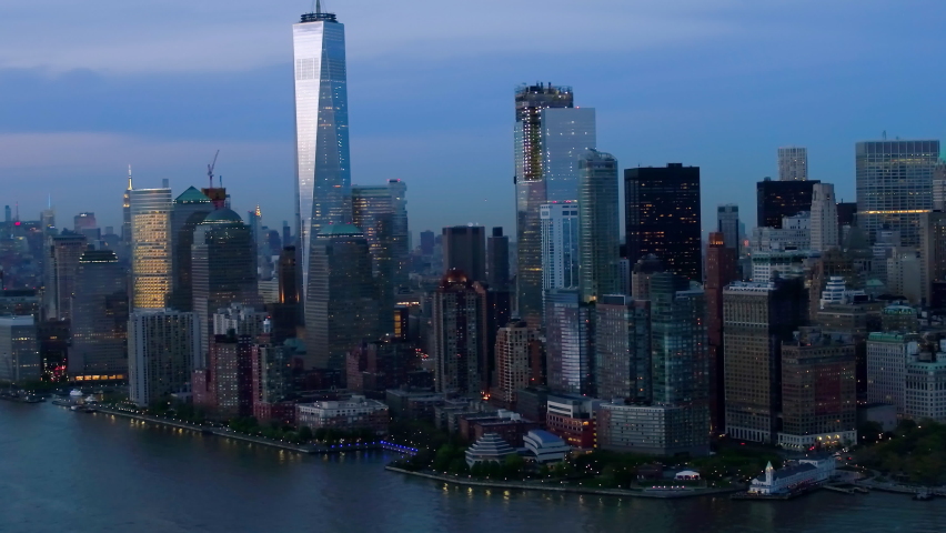 Futuristic Manhattan skyline with stock exchange figures. Augmented reality elements over an aerial view of New York with financial charts and data. Big data, Artificial intelligence, IOT. | Shutterstock HD Video #1063650556