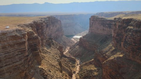 Cinematic aerial flyover of Colorado River at Marble Canyon in morning light in Arizona