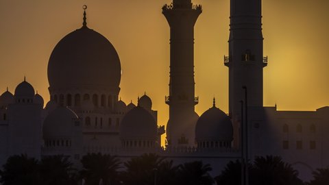 Sheikh Zayed Grand Mosque in Abu Dhabi at sunset timelapse, UAE. Evening close up view from Wahat Al Karama