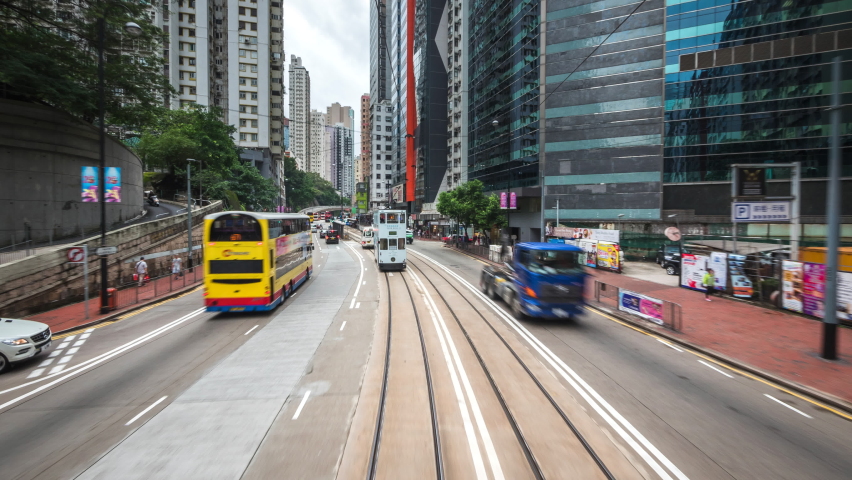 Motion timelapse view of tram ride around central Hong Kong, China, one of the most modern and densely populated cities in the world. 