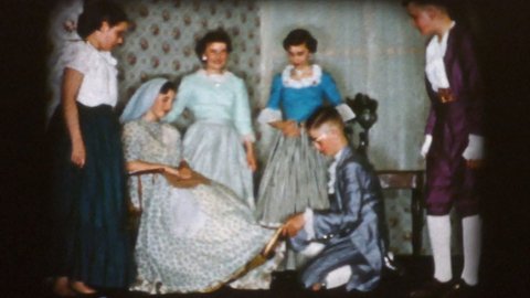 TRENTON, NEW JERSEY, DECEMBER, 1956: A group of high school students performing Cinderella including the fitting of the glass slipper in 1956.