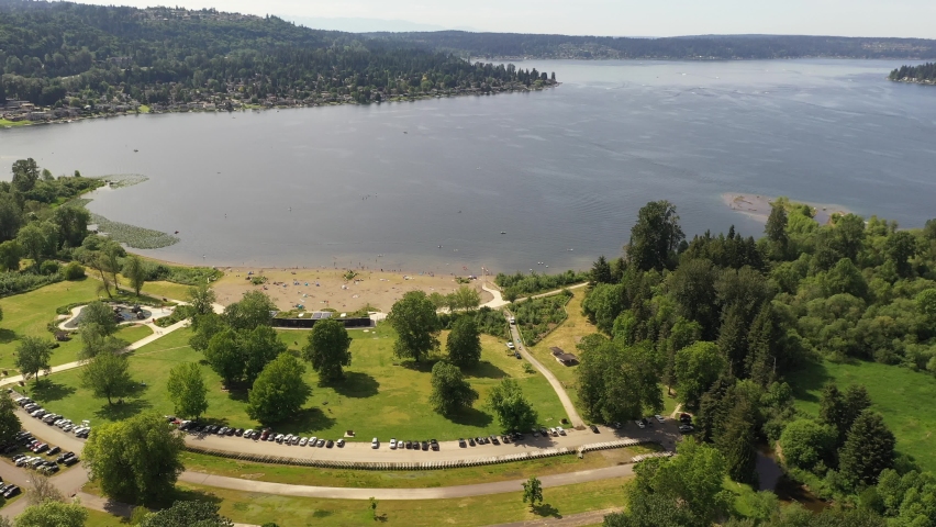 Aerial  drone footage of Lake Sammamish State Park, Issaquah, Sunset Beach, Tibbets Beach, Newport, Montreaux, the I-90 highway, Lake Sammamish and surrounding suburbs in King County, Washington