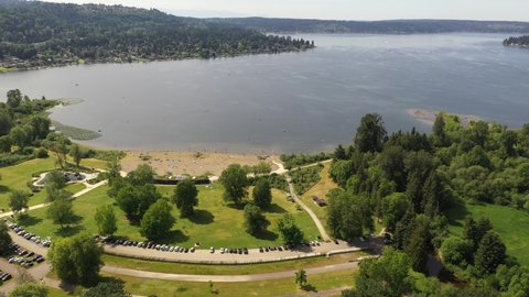Aerial  drone footage of Lake Sammamish State Park, Issaquah, Sunset Beach, Tibbets Beach, Newport, Montreaux, the I-90 highway, Lake Sammamish and surrounding suburbs in King County, Washington