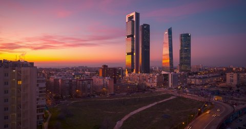 Hyperlapse drone aerial view of Madrid Four tower now Five Towers business area. Timelapse during sunset