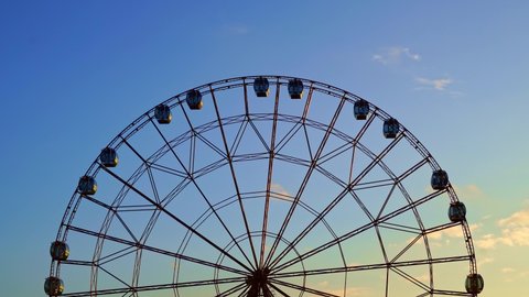 accelerated shooting. Ferris wheel against a blue sky. entertainment for tourists. walks through the resort town. 