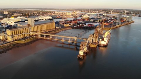 Aerial view of Port of Tilbury, with boats and cruise ships moored at sunset