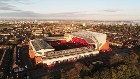 Liverpool , United Kingdom (UK) - 05 20 2020: Iconic Anfield Liverpool football club stadium at sunrise aerial slow orbit right view