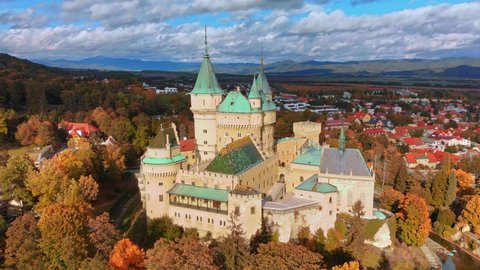 Aerial view of Bojnice medieval castle, UNESCO heritage in Slovakia. Romantic castle surrounded with autumn colors with gothic and Renaissance elements built in 12th century in Bojnice, Slovakia.
