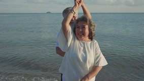 Asian couple senior elder retire resting relax dancing at sunset beach honeymoon family together happiness people lifestyle, Slow motion footage - Powered by Shutterstock - Get 15% off with code: PIKWIZARD15