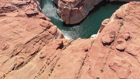 Aerial view of the Colorado River running its course surrounded by steep cliffs at Paige, USA.