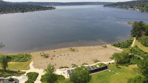 Aerial birdseye footage of Lake Sammamish State Park, Issaquah, Sunset Beach, Tibbets Beach, Newport, Montreux, the I-90 highway, Lake Sammamish and surrounding suburbs in King County, Washington