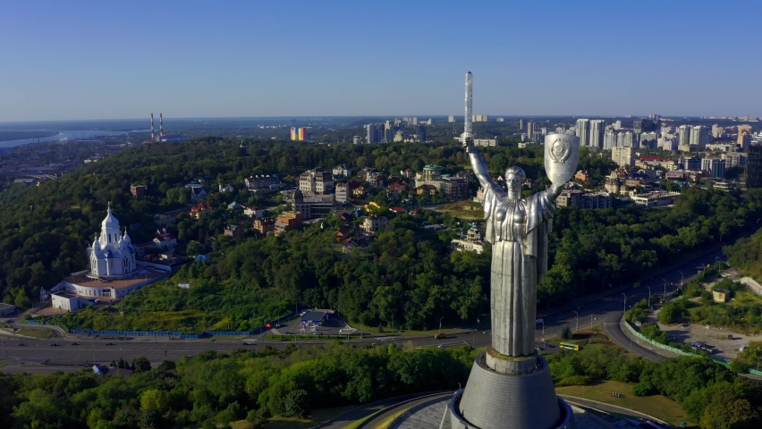 Cinematic aerial view to the Motherland statue in the Kiev. Ukraine. 2020 year. Monument of the Motherland in Kiev, in the summer. Flying a drone around the famous monument in Ukraine Motherland.  | Shutterstock HD Video #1063715749