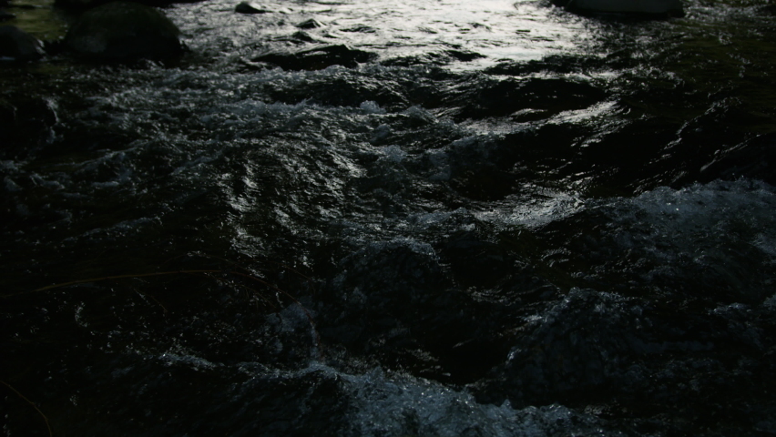 Slow motion shot of Colorado man fly fishing