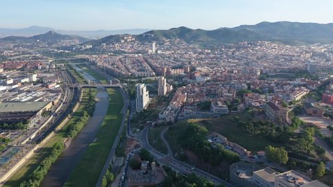 Aerial urban landscape of Santa Coloma de Gramenet municipality and Besos river, Catalonia, Spain. High quality 4k footage