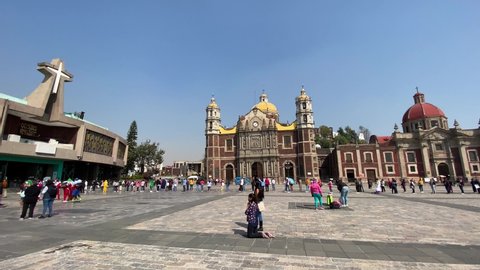 Mexico City, DF - December 9, 2020: A penitent makes her way on her knees to the Basilica of the Virgin of Guadalupe amid the Coronavirus, COVID-19 pandemic.