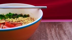 4K video of instant noodle with egg in the bowl, Thailand.