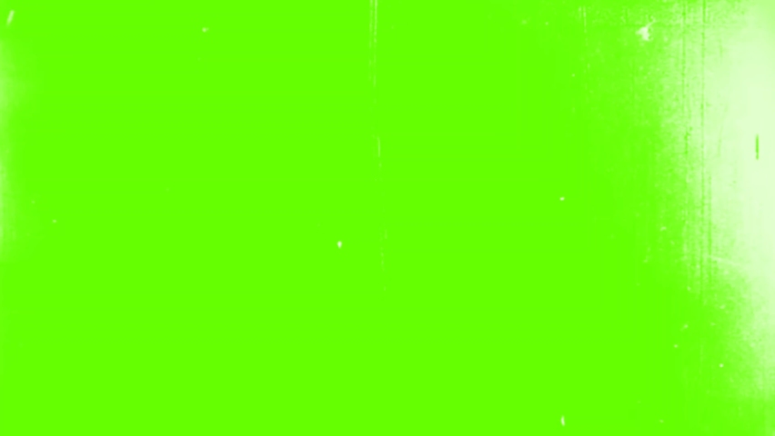 Noisy Old Film Look Overlays Roll Running in Theater projector on Green Screen Background. Old Film Overlay, Splotches, Dust And Damages, Black Noisy Overlay For The Frame On A Green Screen 4K Royalty-Free Stock Footage #1063749583