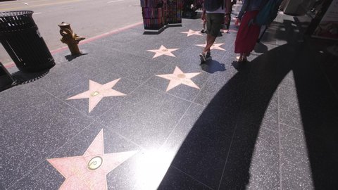 Los Angeles , CA , United States - 05 22 2019: Segment of walk of fame actor stars at Hollywood Blvd sidewalk on black granite
