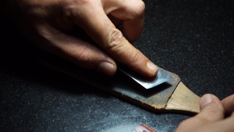 Traditional hand made leather work procedures. 
The process of peeling the leather by hand.