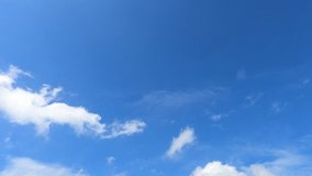 Fluffy puffy white cirrus n cirrocumulus clouds or cumulus cloudscape moving on beautiful bright sunny clear blue sky background in tropical summer sunlight n sun ray at sunny day, 4k b-roll TimeLapse