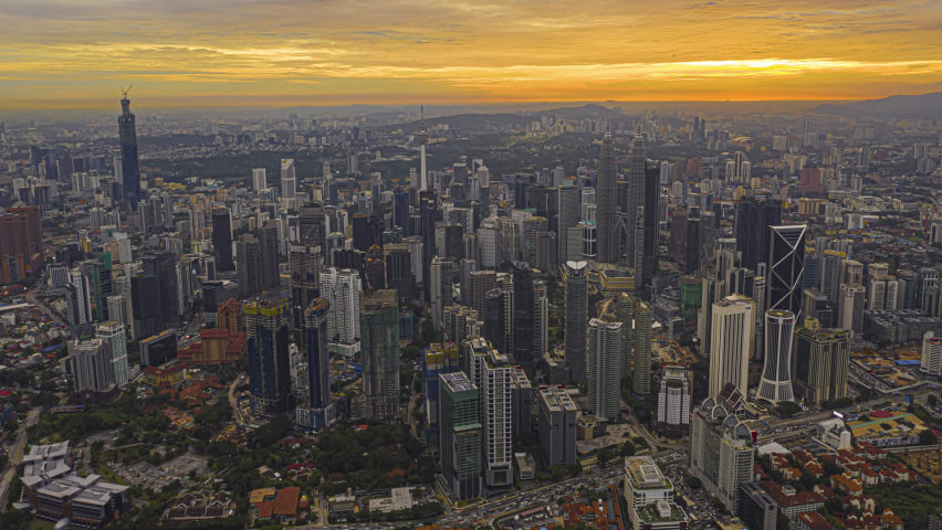 Kuala Lumpur Time Lapse: Sunset of cityscape during a golden sunset overlooking an elevated highway in Kuala Lumpur city. Malaysia. Cinematic. Golden hour. Prores Full HD | Shutterstock HD Video #1063767181