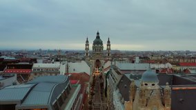 4k footage about the St Stephen basilica in Budapest Hungary at 2020 Christmas time. There is a giant Christmas tree oposite the church. light painting is on the ground 1353 is charity phone number.
