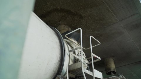 The process of pouring a concrete mixer. Concrete plant - loading concrete mix.
