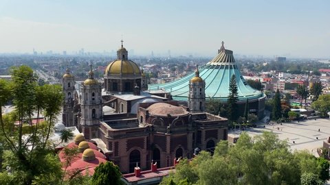 Mexico City, DF, Mexico - December 9, 2020: Panoramic view of the old, left, and the new Basilica of the Virgin of Guadalupe.