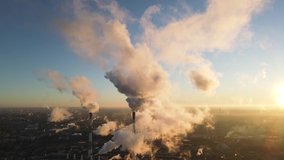 Aerial view of high smoke stack with smoke emission. Plant pipes pollute atmosphere. Industrial factory pollution, smokestack exhaust gases. Industry zone, thick smoke plumes. Climate change, ecology - Powered by Shutterstock - Get 15% off with code: PIKWIZARD15