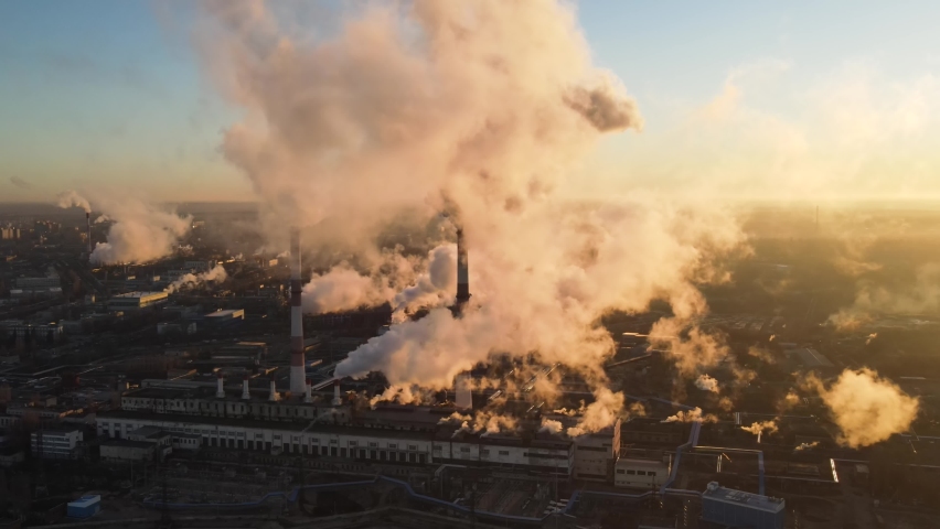 Aerial view of high smoke stack with smoke emission. Plant pipes pollute atmosphere. Industrial factory pollution, smokestack exhaust gases. Industry zone, thick smoke plumes. Climate change, ecology Royalty-Free Stock Footage #1063787629