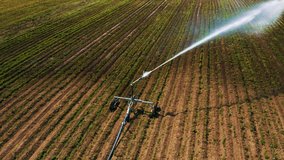 Aerial Drone Fly Over Water Irrigation System in a Farm Land Field Close Up
