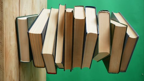 Stack of books background, many books piles, stop motion animation