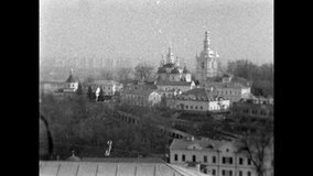 churches in Kiev. filmed with a vintage 16mm film camera. old newsreels. domes of churches against the sky.