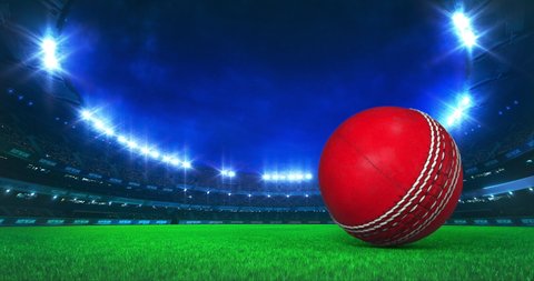 Modern Cricket Stadium with shining lights and ball motion on the grass field. Professional sport 4k video background edited as seamless loop.